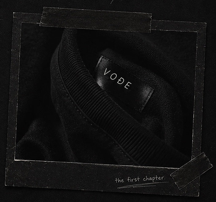 A taped journal photograph showing a VOÐE garment label.